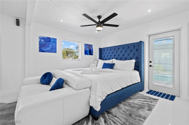 bedroom featuring multiple windows and ceiling fan