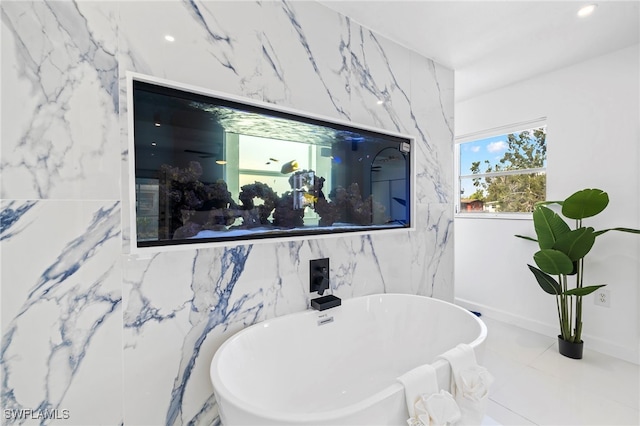 bathroom featuring tile patterned flooring and tile walls