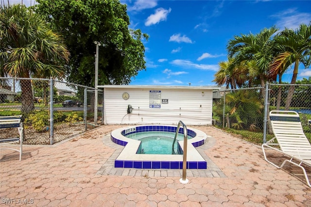 view of pool featuring a hot tub