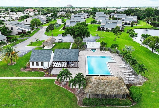 view of swimming pool featuring a lawn and a patio