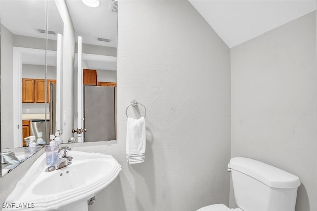 bathroom with sink and toilet