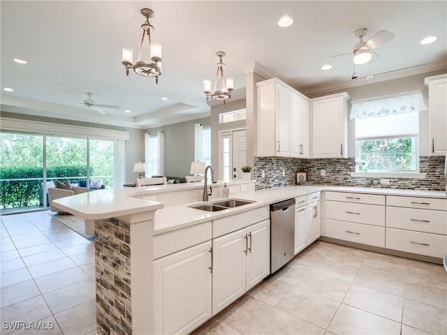 kitchen with ceiling fan with notable chandelier, pendant lighting, sink, and dishwasher