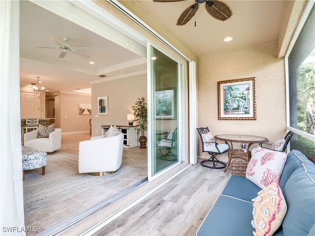 interior space with ceiling fan