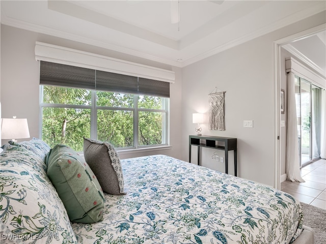 bedroom with ceiling fan, light tile patterned floors, and crown molding