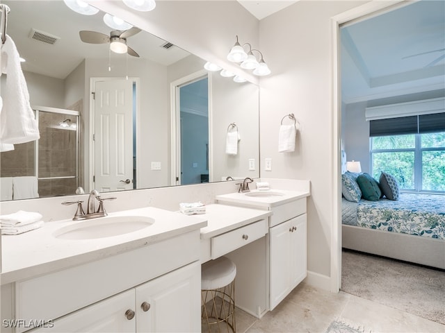 bathroom with vanity, a shower with shower door, tile patterned floors, and ceiling fan