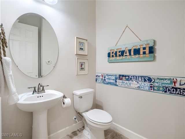 bathroom with tile patterned flooring and toilet