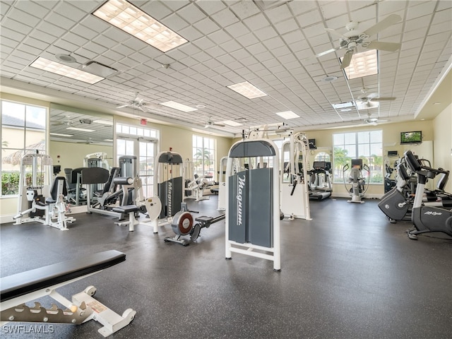 exercise room with plenty of natural light and ceiling fan