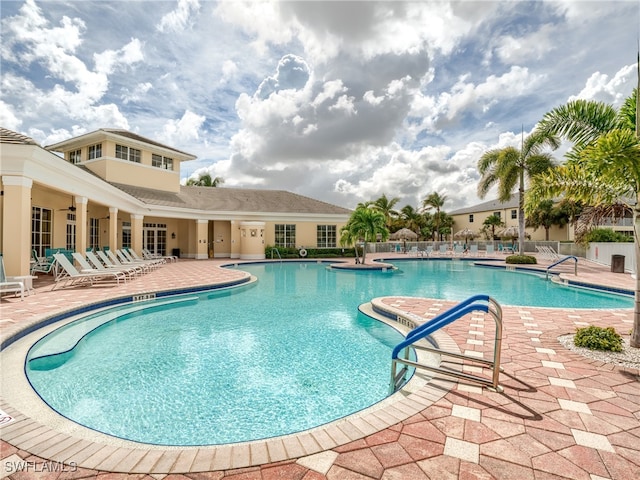 view of swimming pool featuring a patio area