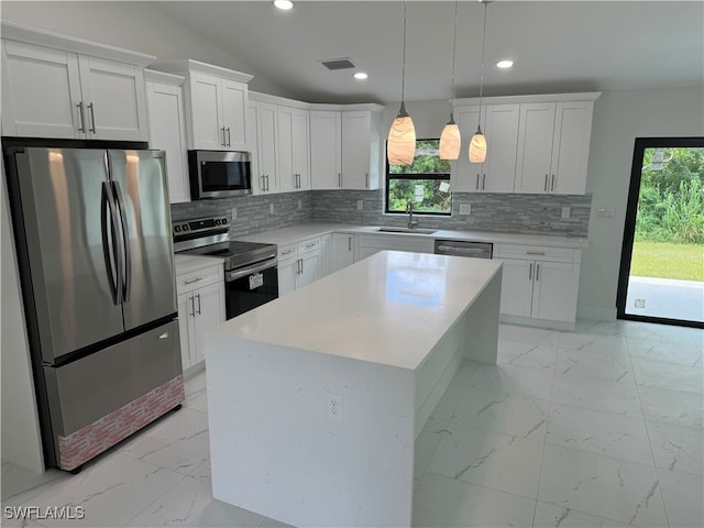 kitchen with light tile patterned flooring, stainless steel appliances, tasteful backsplash, and sink