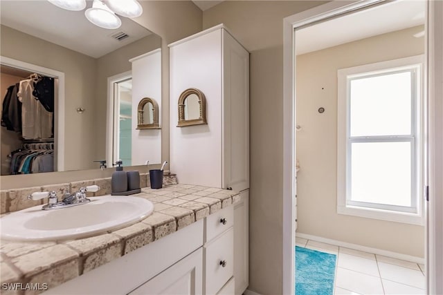 bathroom with vanity and tile patterned flooring