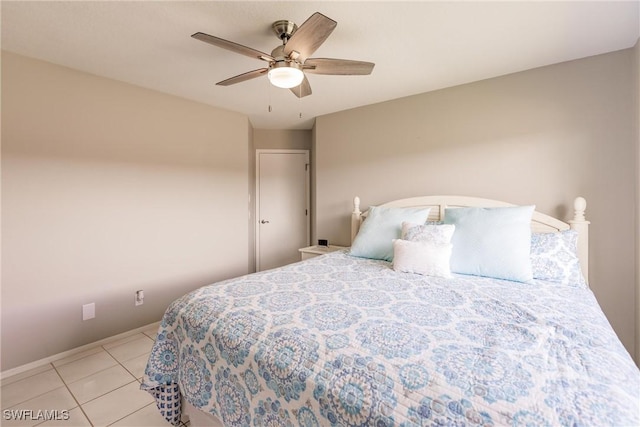 bedroom featuring light tile patterned floors and ceiling fan