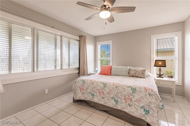 bedroom featuring light tile patterned flooring and ceiling fan