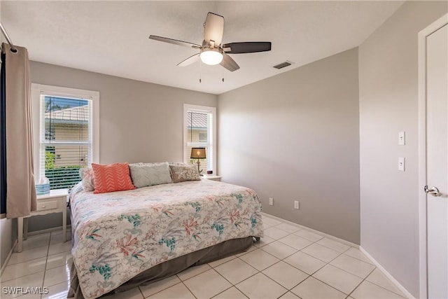 bedroom featuring ceiling fan and light tile patterned flooring