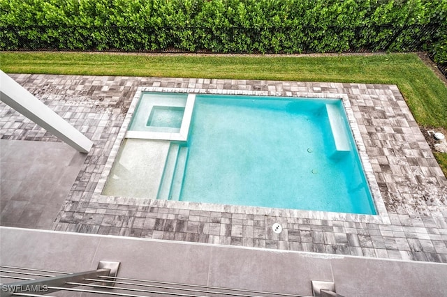 view of pool featuring a yard