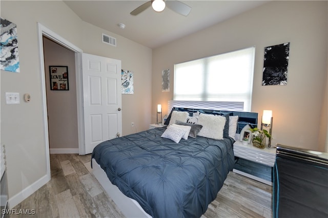 bedroom with ceiling fan and light wood-type flooring