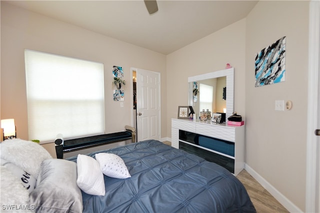 bedroom with ceiling fan and hardwood / wood-style flooring