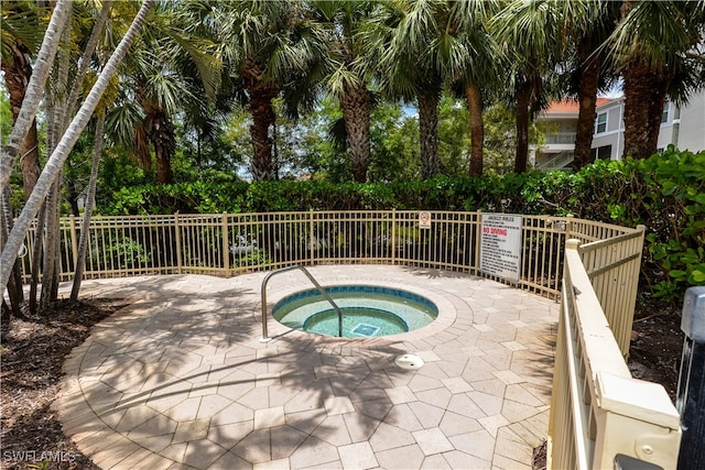 view of swimming pool with a community hot tub and a patio