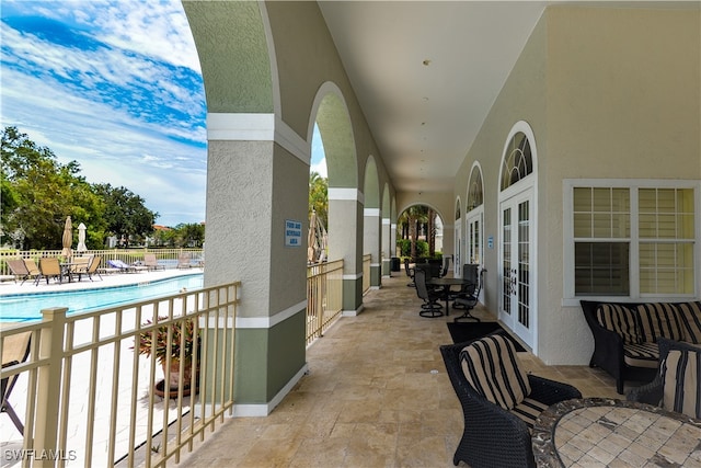 view of patio with a community pool