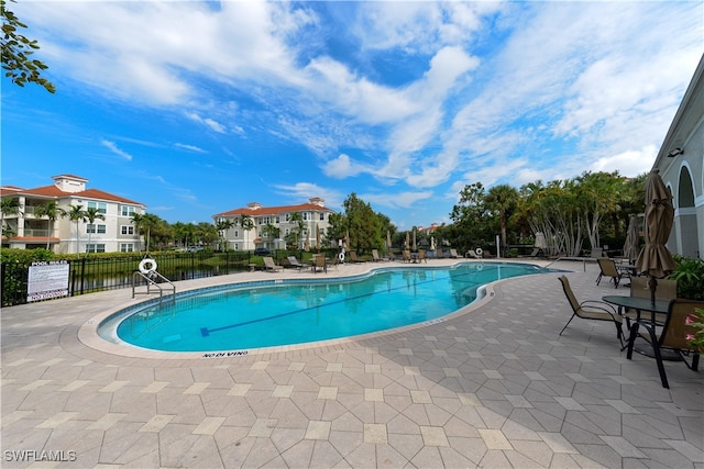 view of swimming pool featuring a patio area