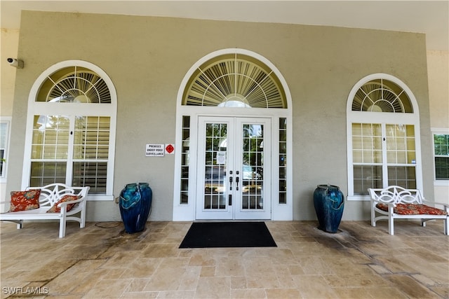 property entrance featuring french doors