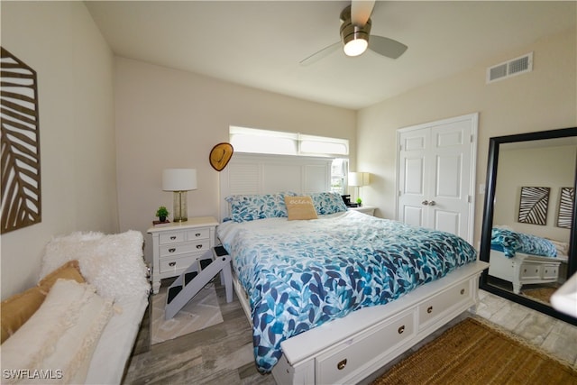 bedroom with ceiling fan and wood-type flooring