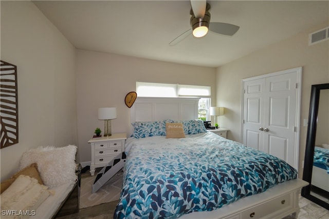 bedroom featuring ceiling fan and light hardwood / wood-style floors