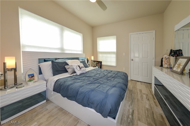 bedroom featuring light wood-type flooring and ceiling fan