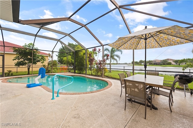 pool with a lanai, a water view, and a patio