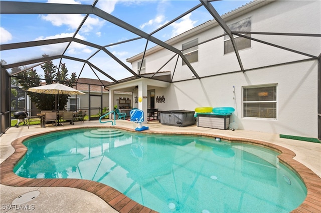 pool featuring glass enclosure, a patio area, and outdoor dining area