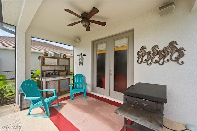 view of patio with french doors and ceiling fan