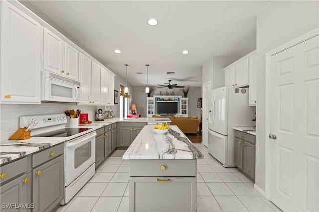 kitchen with white appliances, white cabinetry, open floor plan, gray cabinets, and a center island