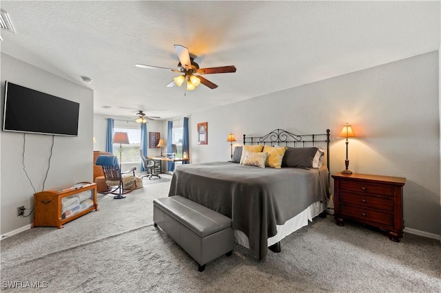 carpeted bedroom with visible vents, ceiling fan, a textured ceiling, and baseboards