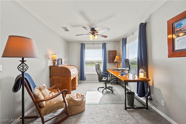 office area with light carpet, visible vents, and baseboards