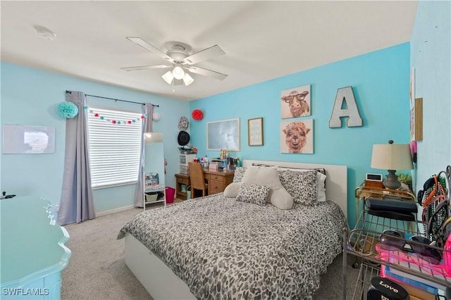 bedroom with ceiling fan, carpet floors, and baseboards