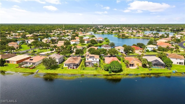 birds eye view of property with a water view and a residential view