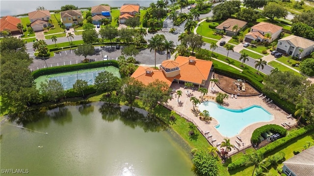 birds eye view of property featuring a water view and a residential view