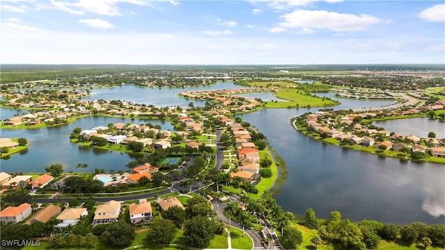 birds eye view of property featuring a residential view and a water view