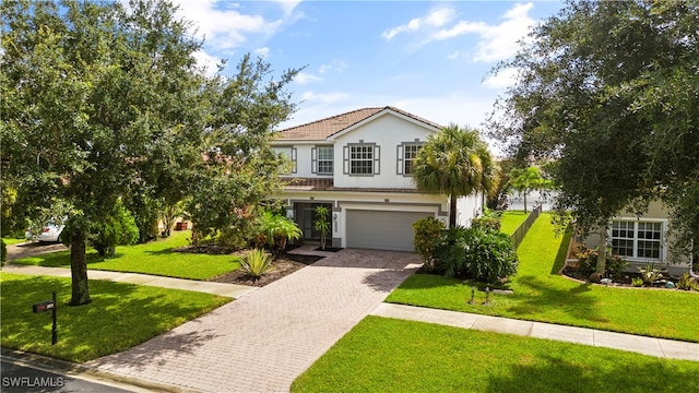 view of front of home featuring a garage and a front yard