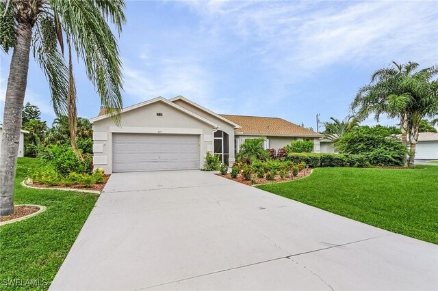 ranch-style home with a garage and a front lawn