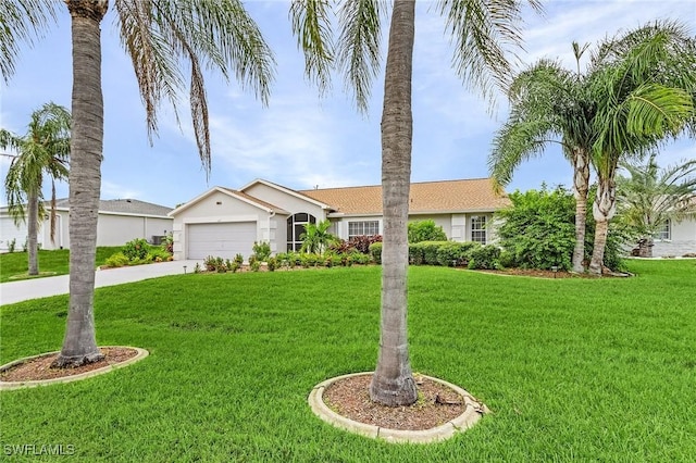 ranch-style home featuring a garage, a front yard, concrete driveway, and stucco siding