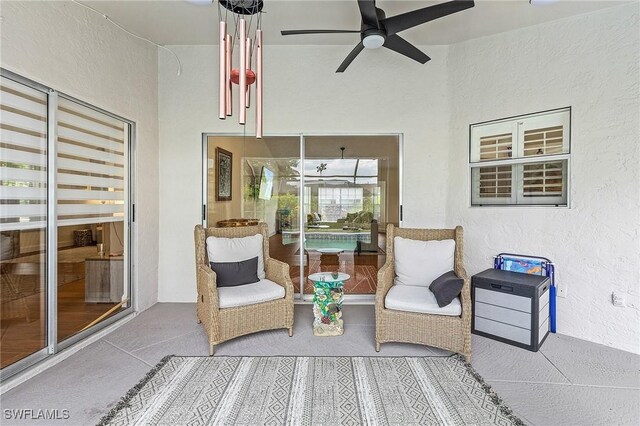 sunroom with ceiling fan