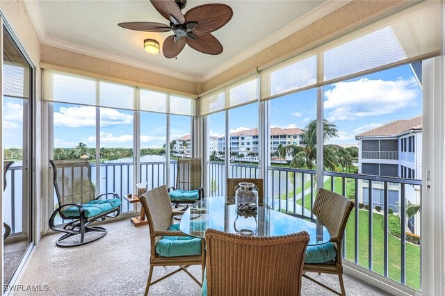 sunroom featuring ceiling fan and a healthy amount of sunlight