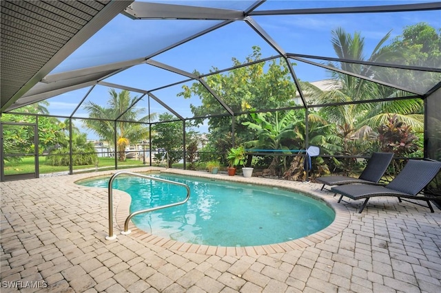 view of pool featuring a lanai and a patio