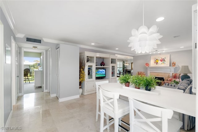 dining room with a chandelier, recessed lighting, a fireplace, visible vents, and crown molding