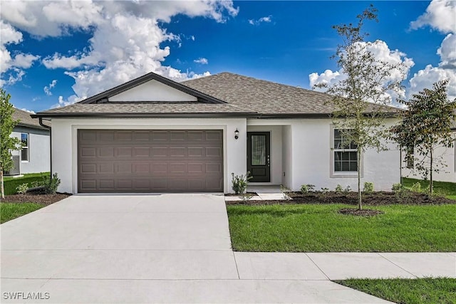 single story home featuring a shingled roof, concrete driveway, an attached garage, a front lawn, and stucco siding