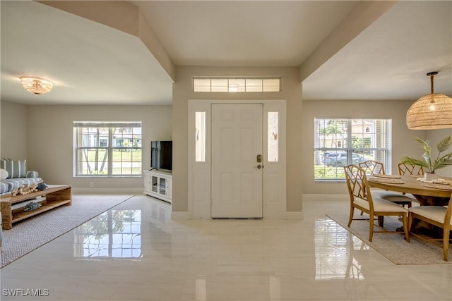 foyer featuring plenty of natural light