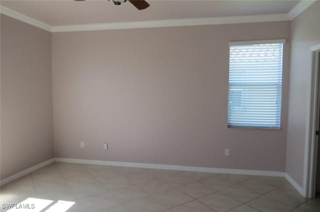 spare room featuring ornamental molding, light tile patterned flooring, and ceiling fan