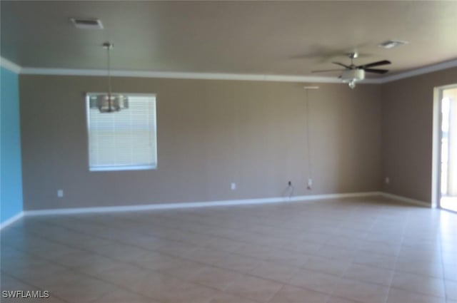 empty room with crown molding and ceiling fan