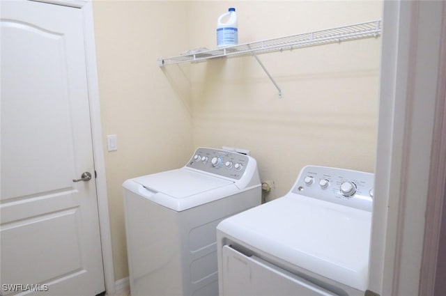 washroom featuring separate washer and dryer