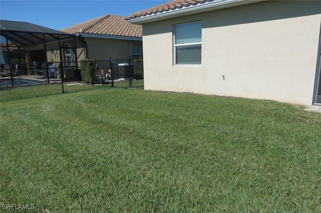 view of yard featuring a lanai